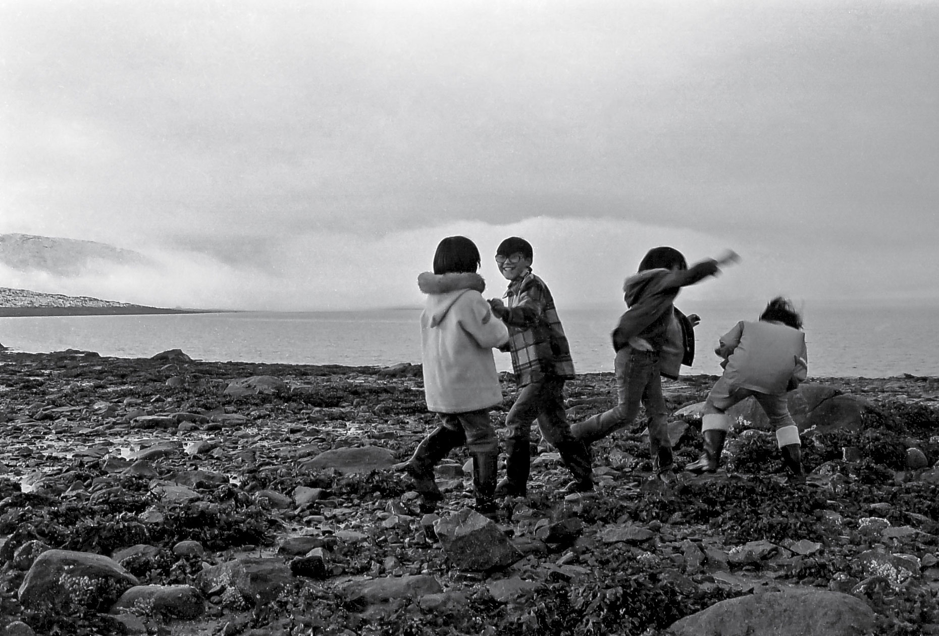 23-Inuit-boys-fooling-around-After-the-tide,-Cape-Dorset,-Canadian-Arctic-